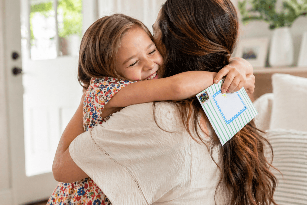 Mom and daughter reading Happy Mail together